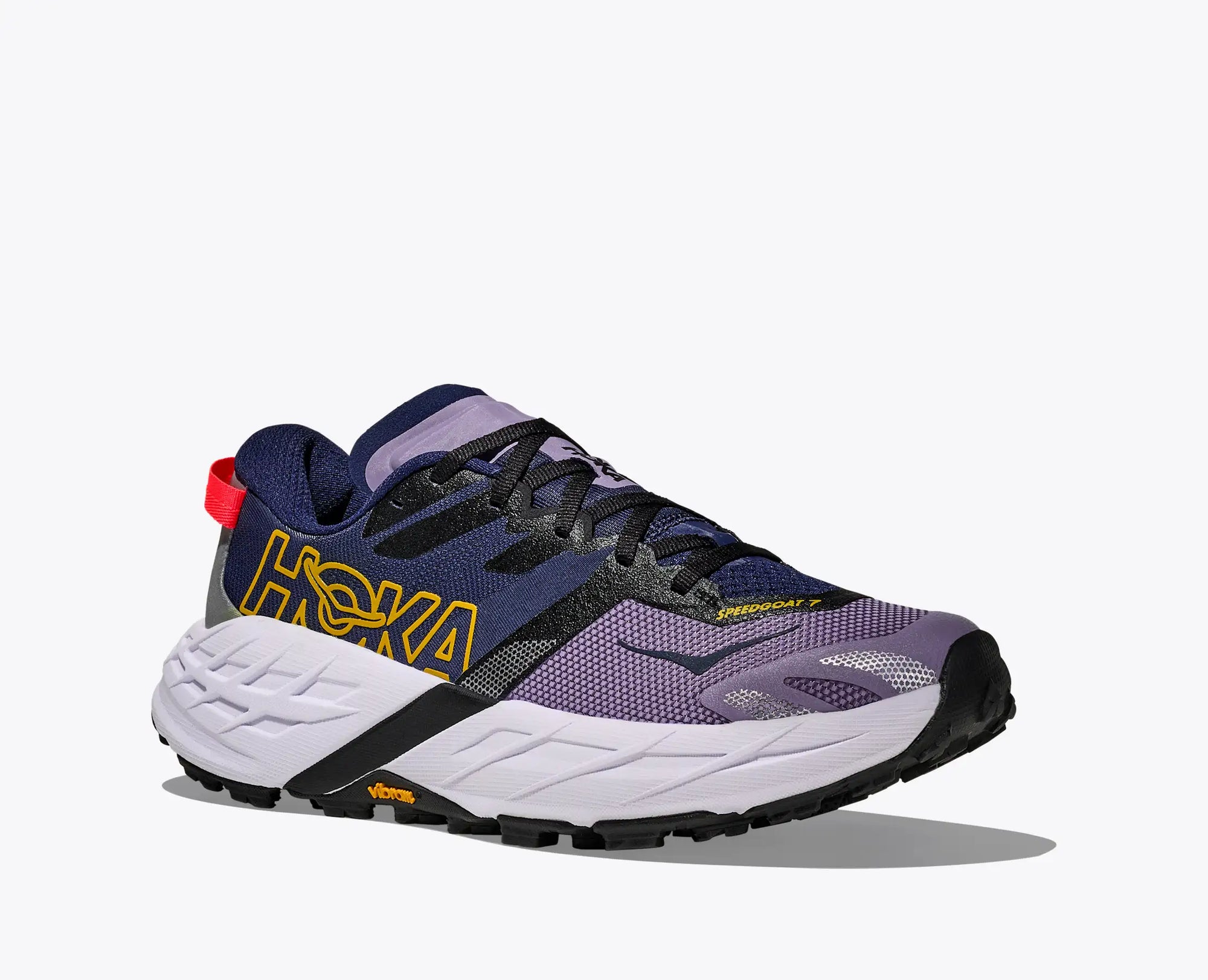 Trail running shoe in navy blue and purple colorway with white midsole, side view