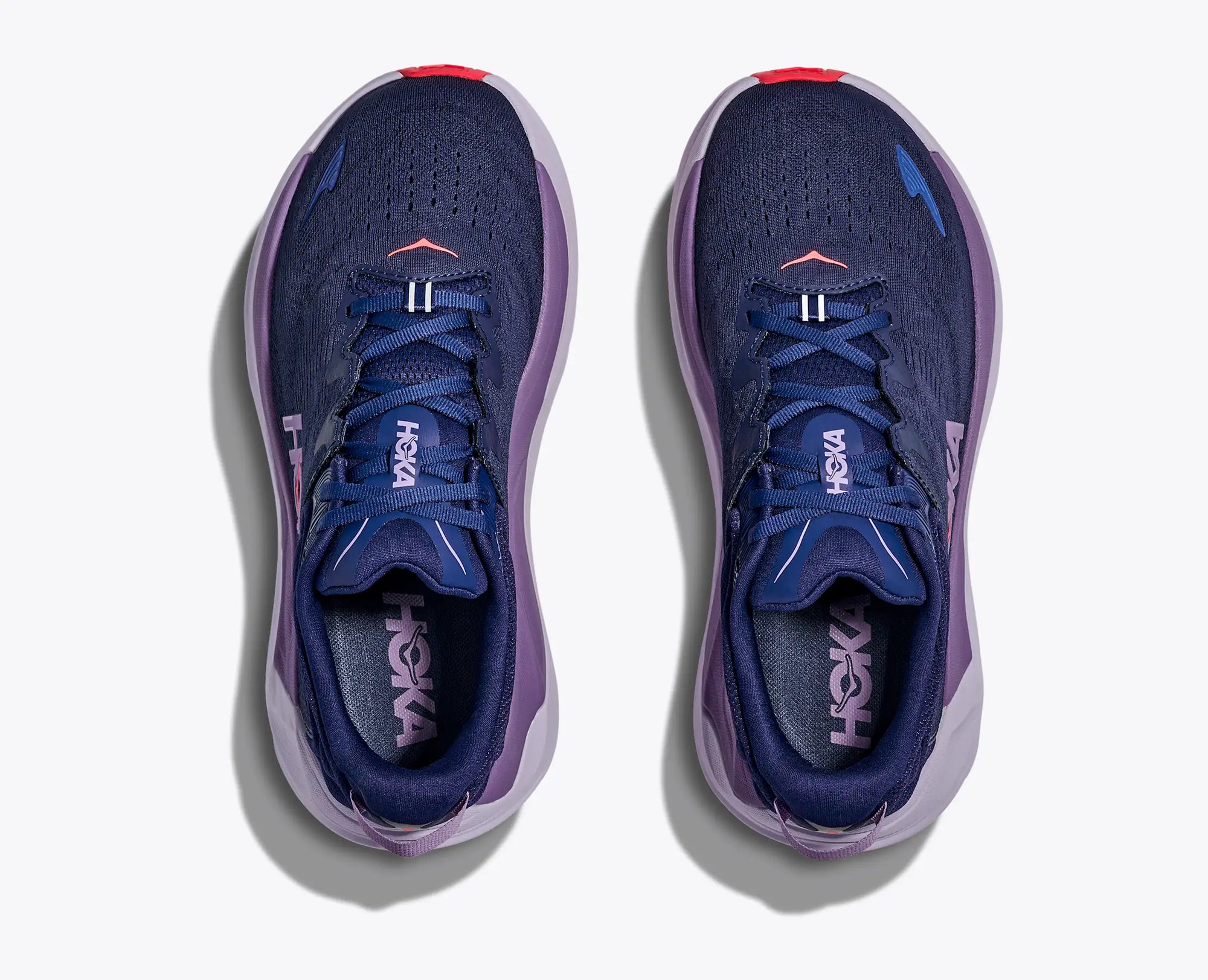 Navy blue running shoes with purple midsole, top view showing mesh upper and lacing
