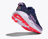 Navy blue running shoe with purple accents and coral red sole, angled side view