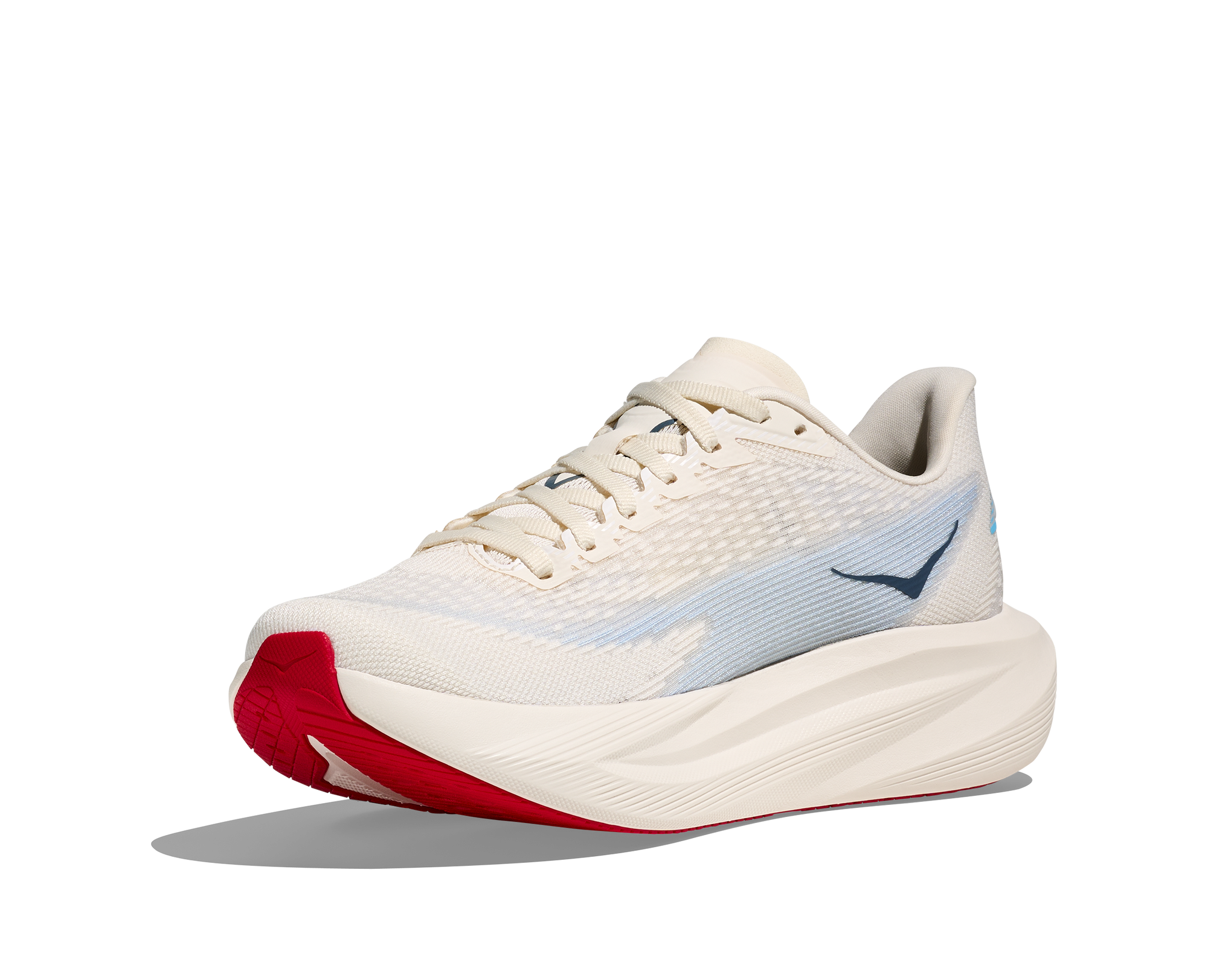 Light colored running shoe with textured upper, thick midsole, and red outsole detail