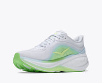 Women's running shoe in white with green gradient panel and bright green outsole, three-quarter view