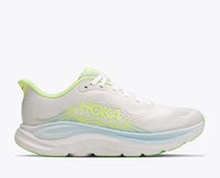 Women's running shoe with thick cushioned sole, white upper, and neon green accents, lateral view