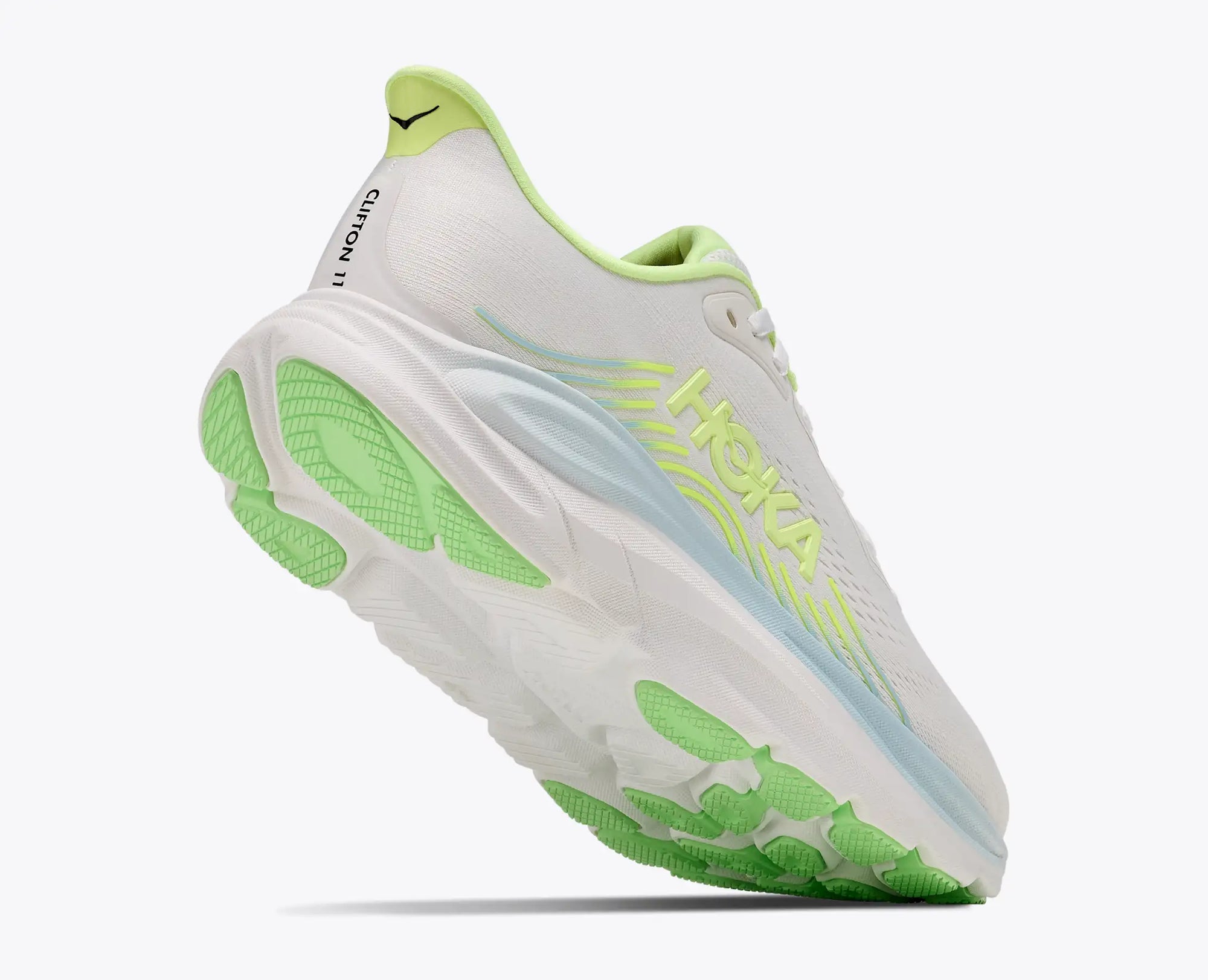 Women's running shoe with white mesh upper, neon green sole and accents, angled rear view