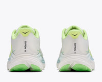 Running shoes rear view showing thick cushioned midsole, green outsole, and lime collar padding