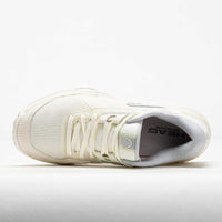 Women's tennis shoe in off-white, top-down view showing laces, mesh upper, and branded insole