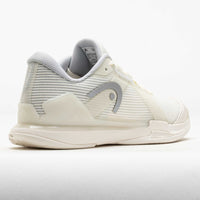 Women's tennis shoe rear three-quarter view, white with grey mesh panels and brand logo