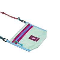 Small mint green crossbody bag with colorful zipper pocket, rope strap, and carabiner clips