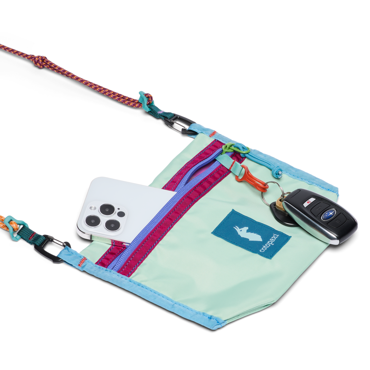 Small crossbody pouch with rope strap, showing phone pocket and key fob clip, open view