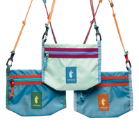 Three small crossbody bags with rope straps, front zipped pockets, and llama logo patches