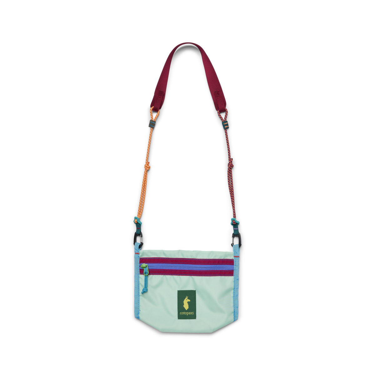 Small mint green crossbody bag with colorful rope strap, dual zippers, and llama logo patch