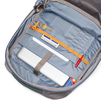 Interior view of 26L backpack showing organized compartments with keys, pen, and accessories