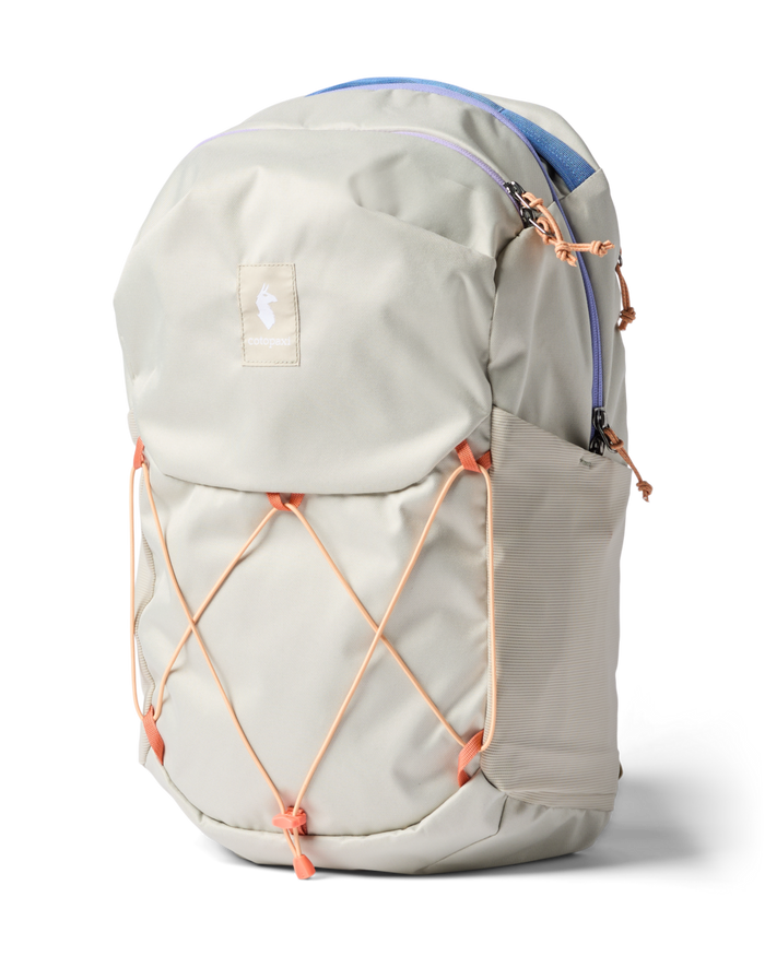 Light gray daypack with orange bungee cord system and padded shoulder straps, side view