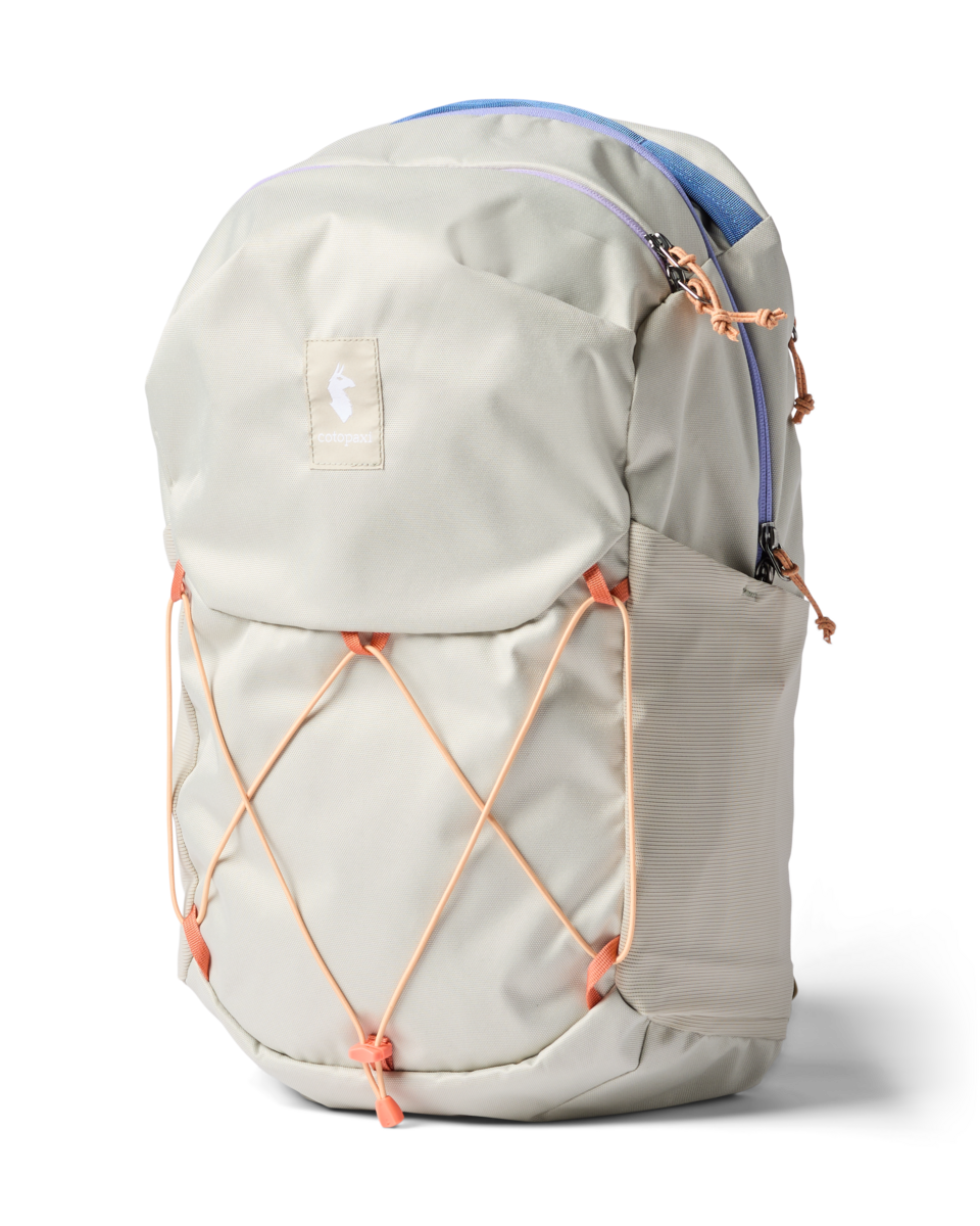 Light gray daypack with orange bungee cord system and padded shoulder straps, side view