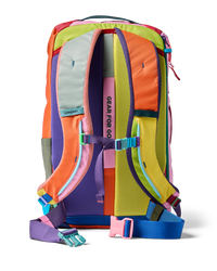 Multicolored patchwork travel backpack shown from back view with shoulder straps and chest strap visible
