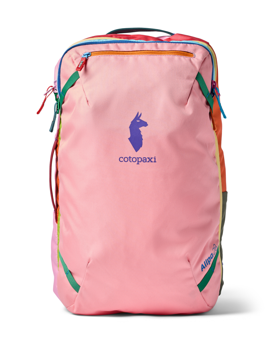 Pink travel backpack with rainbow-colored trim and zippers, front view on white background