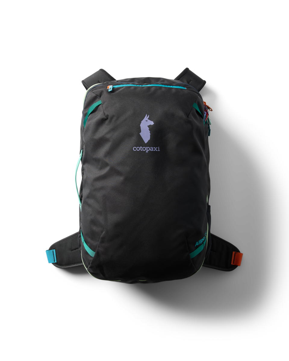 Dark gray travel backpack with turquoise zippers and straps, front view on white background