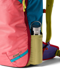 Colorful travel backpack with multicolor panels and side water bottle pocket detail
