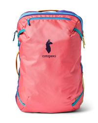 Coral pink travel backpack with colorful accent panels and front zip pocket