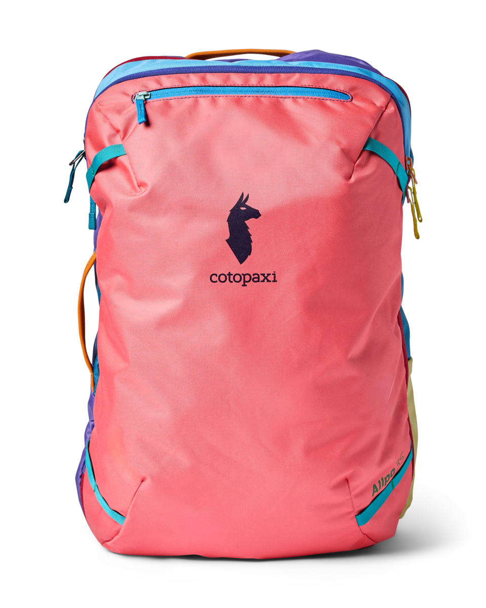 Coral pink travel backpack with colorful accent panels and front zip pocket