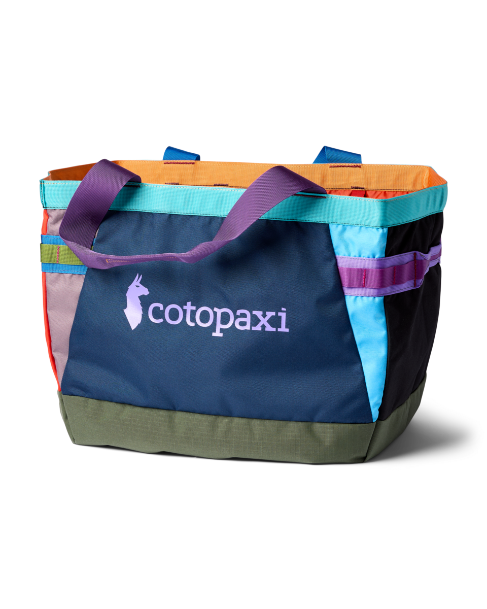 Large tote bag with colorful patchwork design featuring multiple fabric panels and shoulder straps