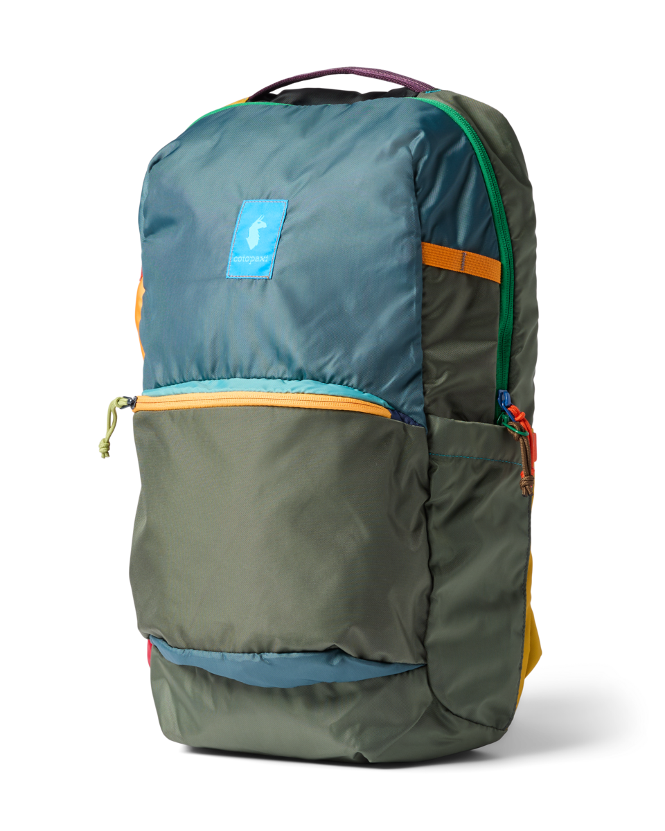 26-liter daypack with multicolor panels, front zip pocket, and side mesh pocket, three-quarter view