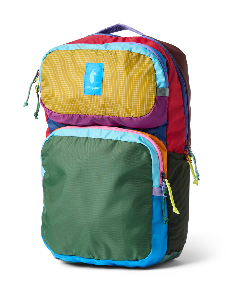 Colorful patchwork backpack with yellow, green, purple, red, and blue panels, front view