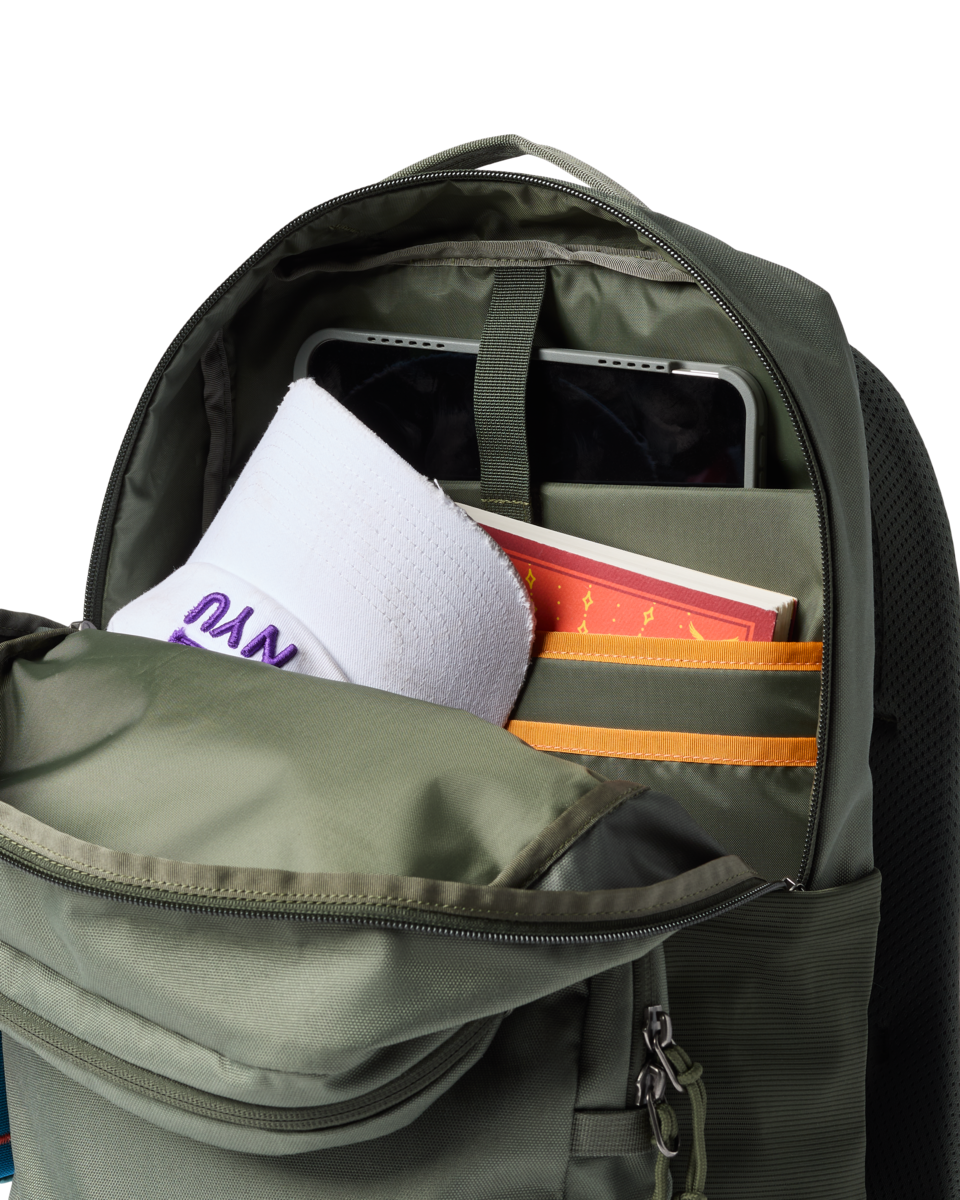 Olive green backpack with main compartment open showing laptop sleeve and organizational pockets