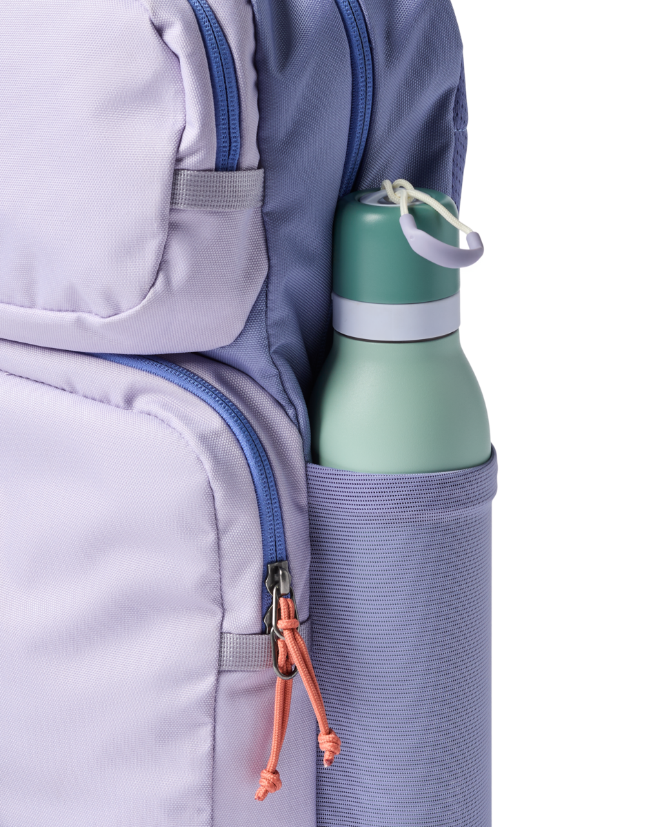 Light purple backpack with blue accents, side view showing water bottle in mesh pocket