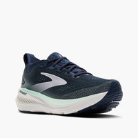 Navy blue running shoe with mesh upper, white midsole, and mint green accent stripe