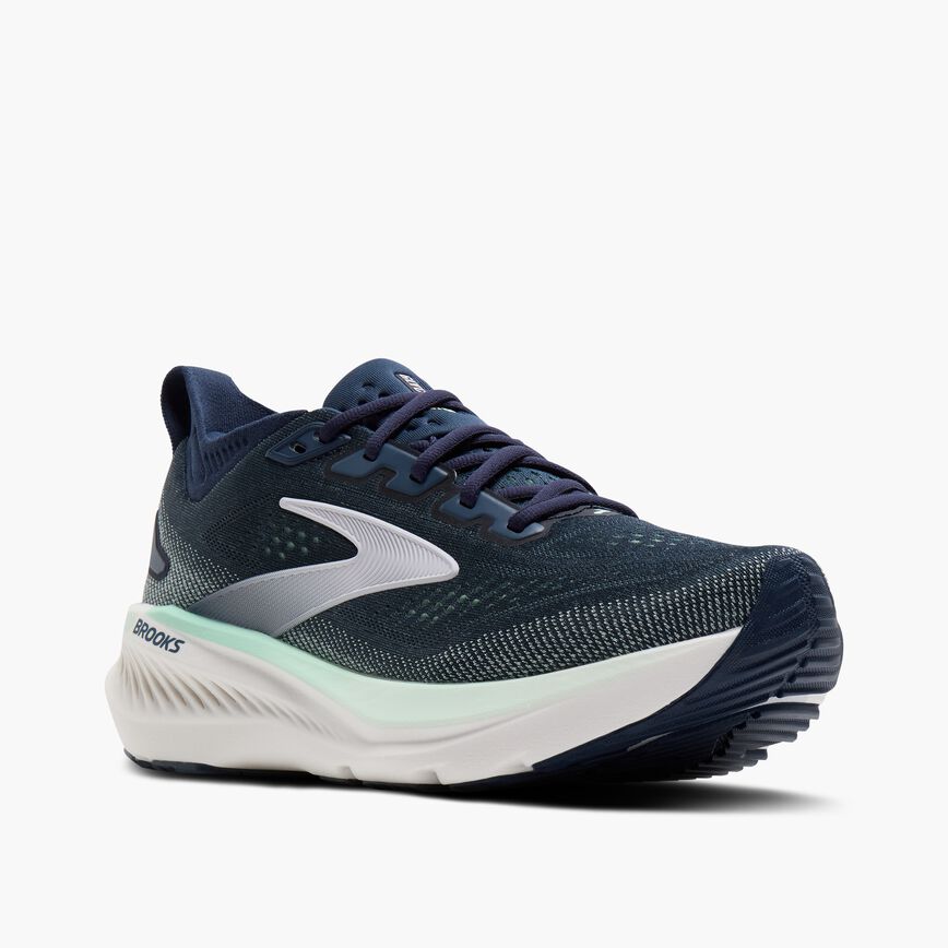 Navy blue running shoe with mesh upper, white midsole, and mint green accent stripe