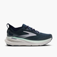 Navy and teal running shoe with white sole, side profile view