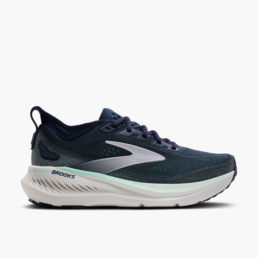 Navy and teal running shoe with white sole, side profile view