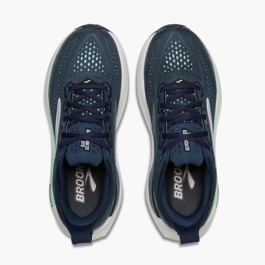 Navy running shoes with mint accents, top-down view showing perforated toe box and lacing