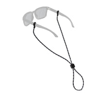 Black rope eyewear retainer attached to clear sunglasses with adjustable slider bead