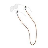 Brown suede eyewear retainer strap with black connectors attached to clear safety glasses