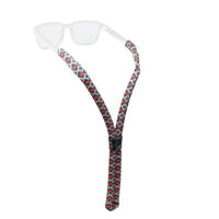 Floating eyewear retainer with colorful geometric diamond pattern attached to clear sunglasses