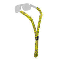 Yellow patterned floating eyewear retainer strap attached to clear sunglasses on white background