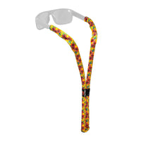 Floating eyewear retainer with colorful floral pattern attached to clear sunglasses