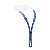 Floating eyewear retainer strap with blue and red geometric pattern, clear background