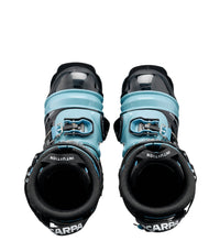 Pair of alpine ski touring boots with light blue cuff and black shell, top-down view