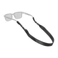 Black leather eyewear retainer strap with metal clips attached to clear sunglasses