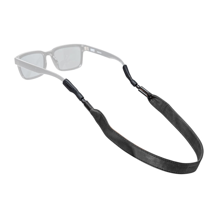 Black leather eyewear retainer strap with metal clips attached to clear sunglasses