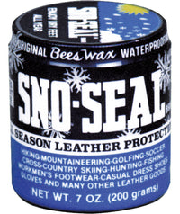 Round tin container of beeswax waterproofing product with blue and black label showing snowflake designs