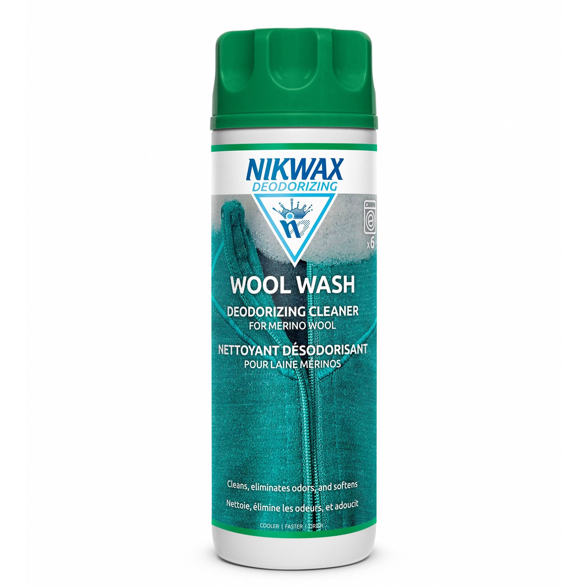 Green and white aerosol bottle of wool wash deodorizing cleaner with mountain design