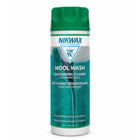 Green and white aerosol bottle of wool wash deodorizing cleaner with mountain design