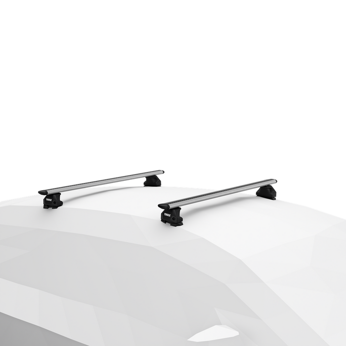 Two aluminum roof rack crossbars with black mounting clamps installed on white car roof