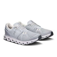 Light gray running shoes with distinctive segmented white sole and mesh upper construction