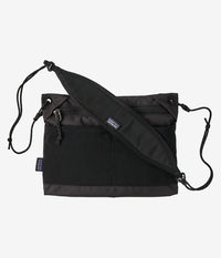 Black crossbody bag with adjustable shoulder strap and front zippered pocket