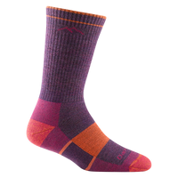 Crew-length hiking sock in purple with colorblock pink and orange heel and toe accents