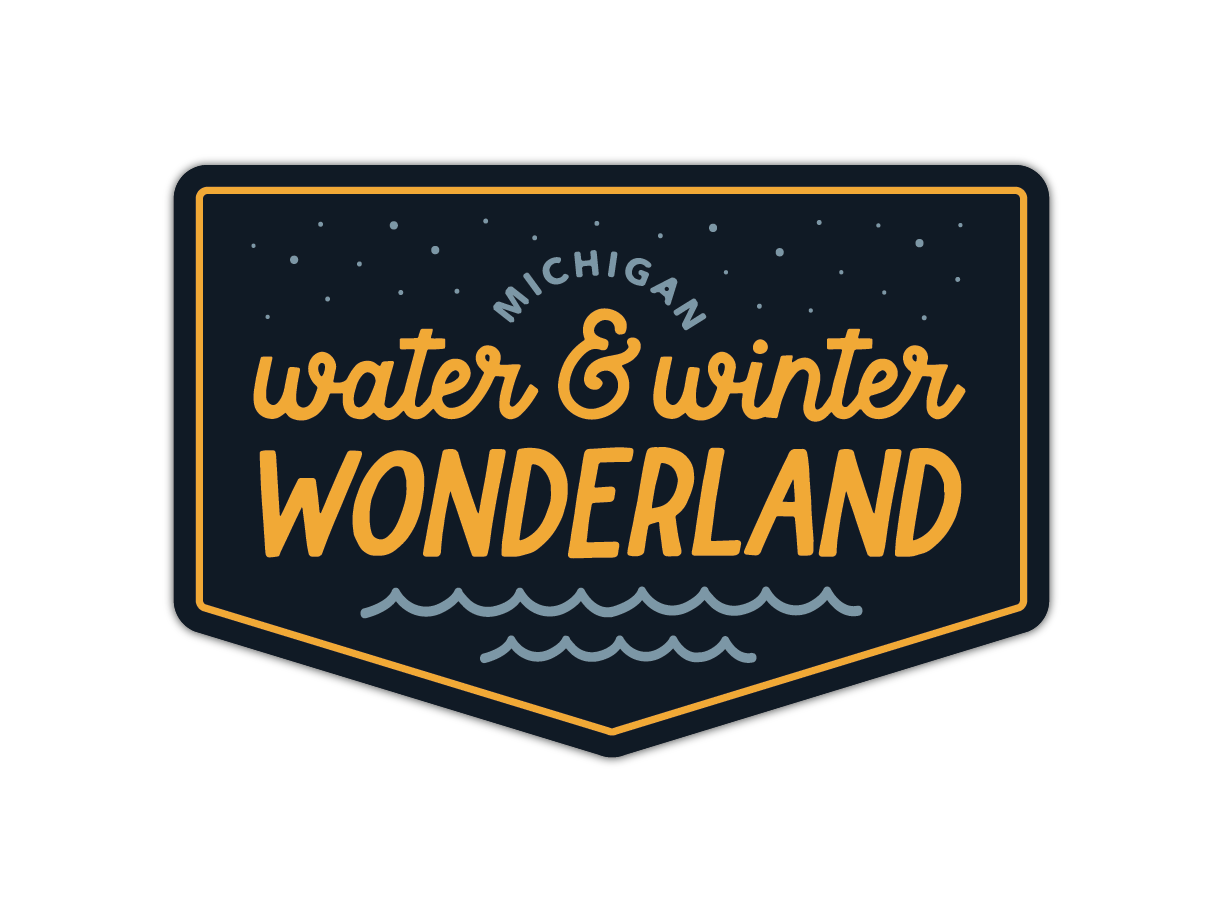 Shield-shaped sticker with navy background, orange text reading water and winter wonderland with stars